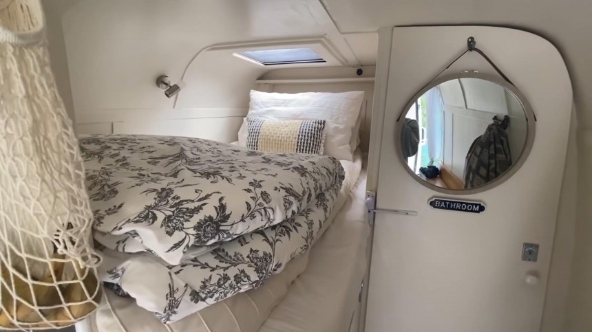 Self\-Built Camper Van Is a Unique Apartment on Wheels With an Epic Garage and a Hidden TV