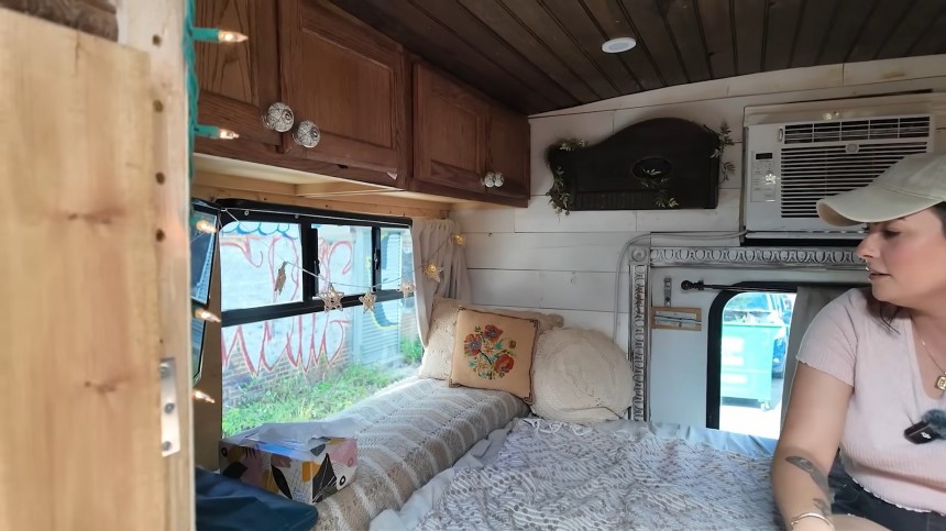 Shuttle Bus Was Transformed Into a Rustic Cottage on Wheels With Storage Spaces Galore