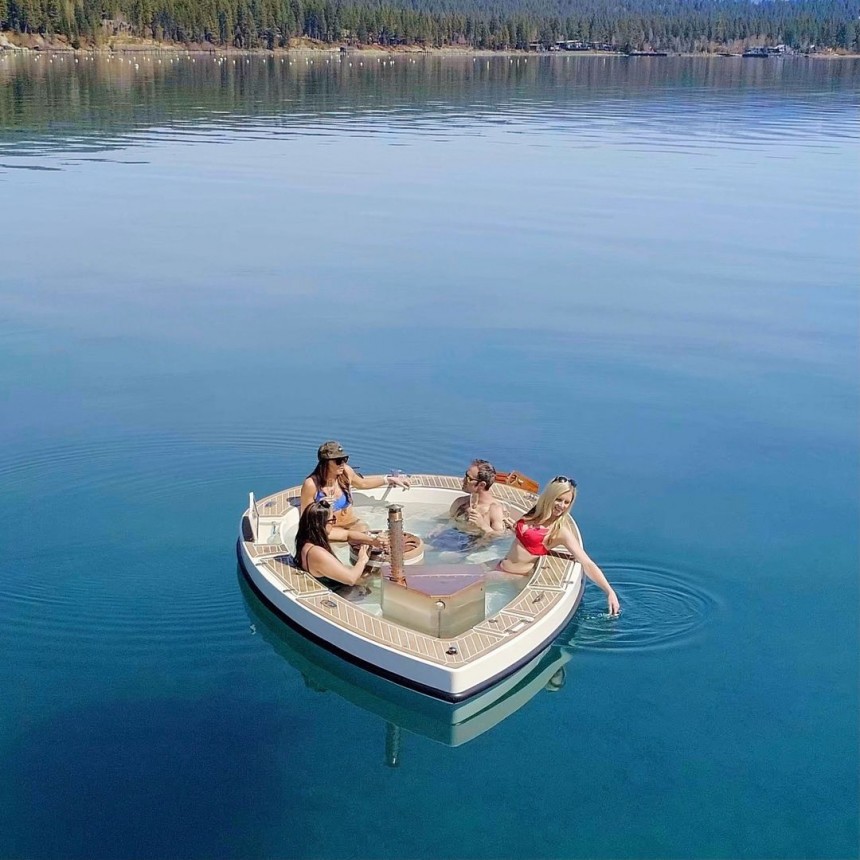 Spacruzzi is a hot tub boat with a fireplace stove and claims of being the greenest floating hot tub ever