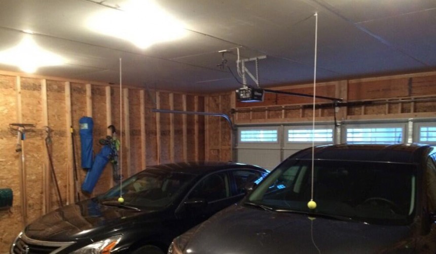Hanging tennis balls in a four\-car garage to make sure everyone does not exceed their spots