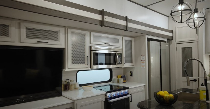 The 2023 Keyston Sprinter Limited 3900DBL has two kitchens, two full baths, a master suite, and a bunkhouse with a very creative layout