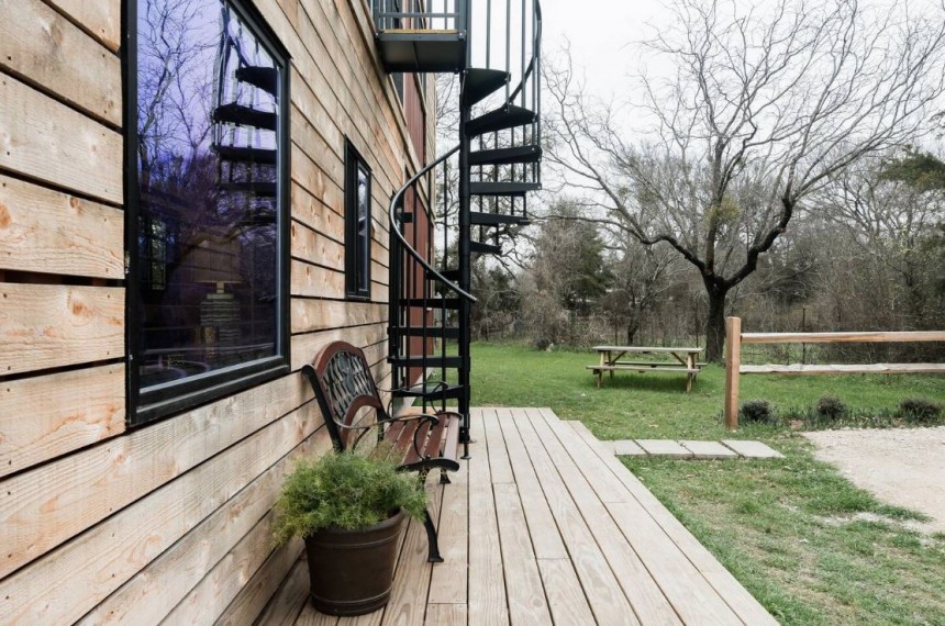 The Helm is a two\-level tiny home with a private deck and two full bathrooms