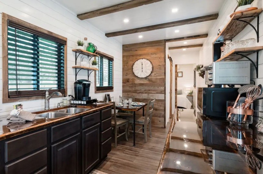 The Helm is a two\-level tiny home with a private deck and two full bathrooms