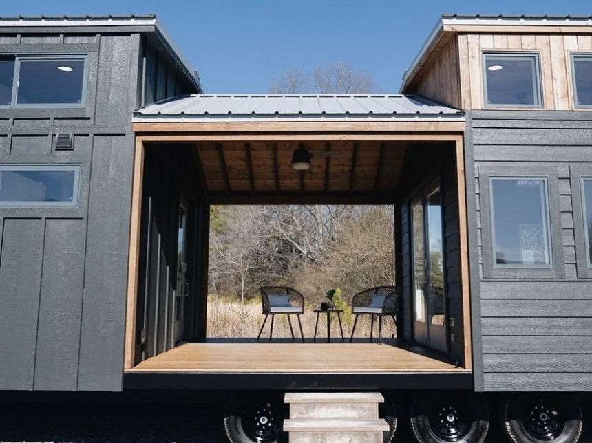 The Pisgah park tiny has an in\-built porch in the middle of the trailer to create more defined spaces