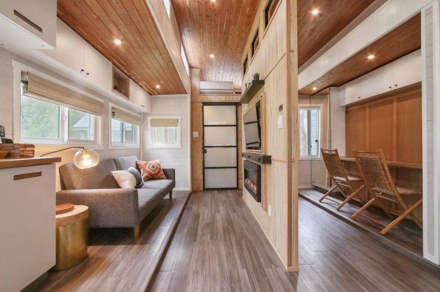 The SerendipTiny home is based on the Aurora model, with two massive slide\-outs nearly doubling living space at camp