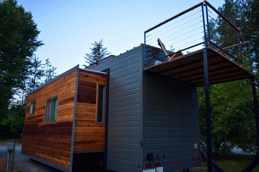 The SerendipTiny home is based on the Aurora model, with two massive slide\-outs nearly doubling living space at camp
