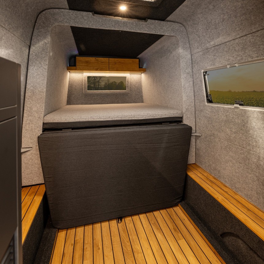 The Rebel 4x4 is a Sprinter\-based conversion with a pullout bedroom and transformable bathroom