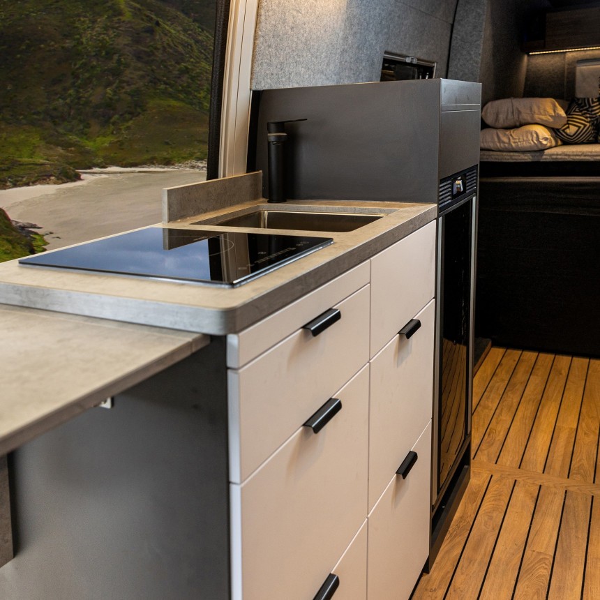 The Rebel 4x4 is a Sprinter\-based conversion with a pullout bedroom and transformable bathroom