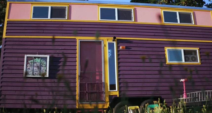 Lovely and brightly\-colored tiny house on wheels