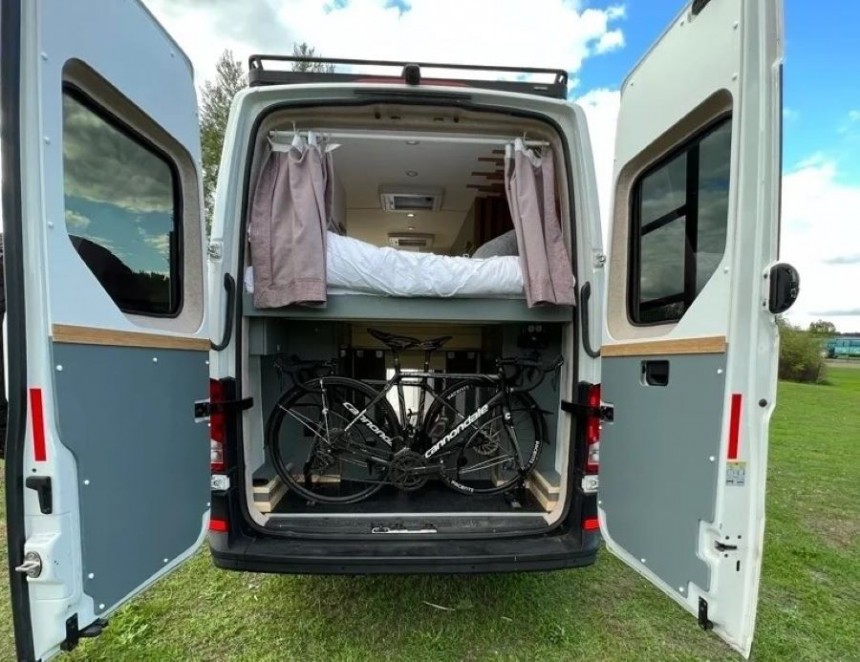Custom van conversion with L\-shaped couch