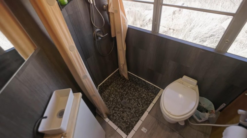 Bus Turned Tiny Home on Wheels Features a One\-of\-a\-Kind Kitchen and a Gigantic Bathroom