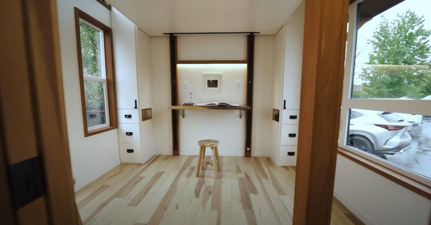 This custom park model tiny house is a complete family home with a bunch of surprising features