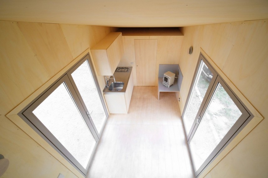 Tiny house opens up to allow natural light to bathe the inside
