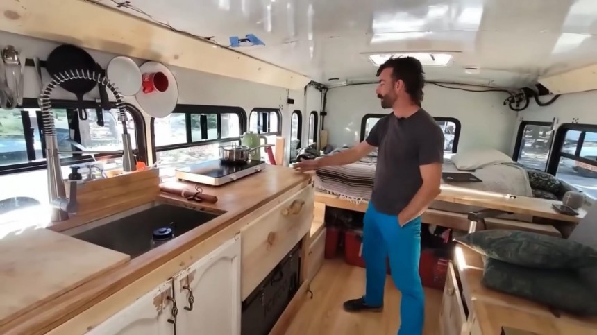 This Shuttle Bus Is an Affordable Off\-Grid Home on Wheels With a Hidden Bathtub