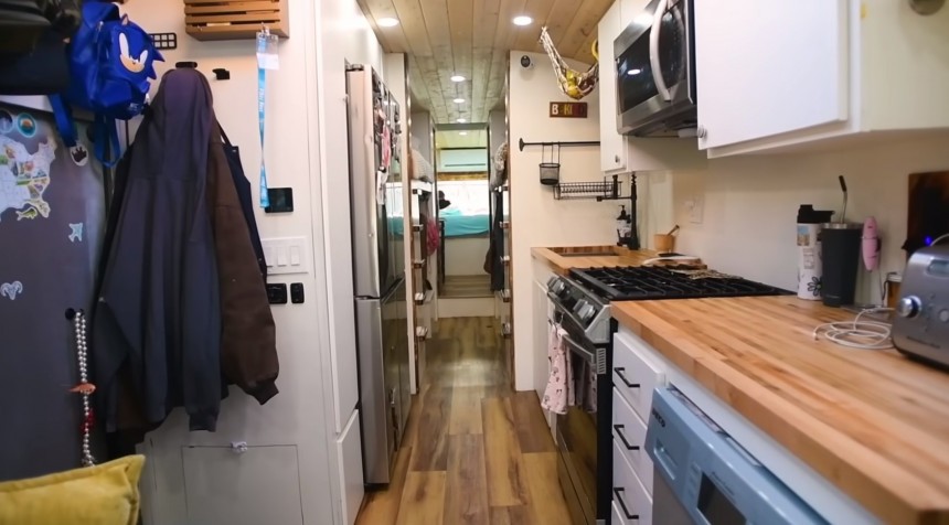 School Bus Converted Into a mobile Home With a Roof Raise
