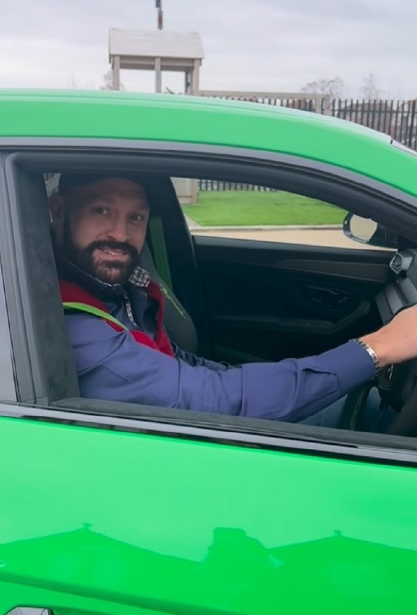 Tyson Fury shows off his new ride, a bright green Lamborghini Urus
