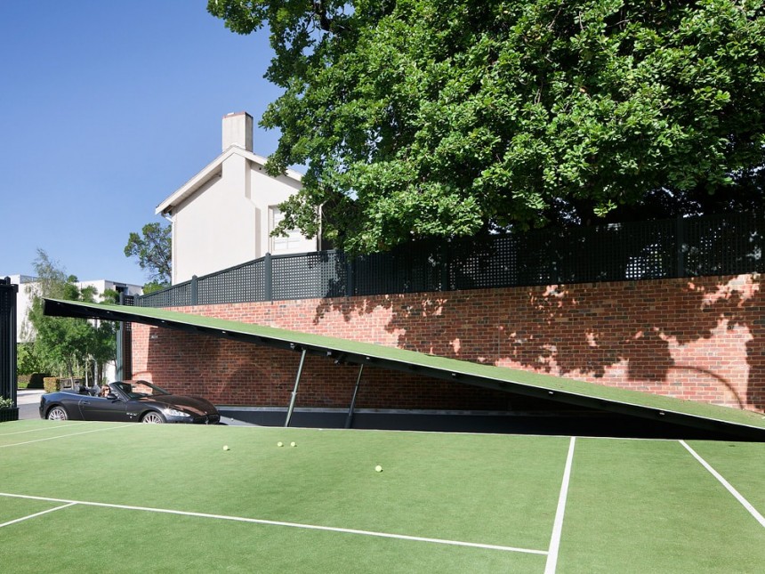 Wayne Residence hides a 12\-car garage under the tennis court, styled after the Batcave