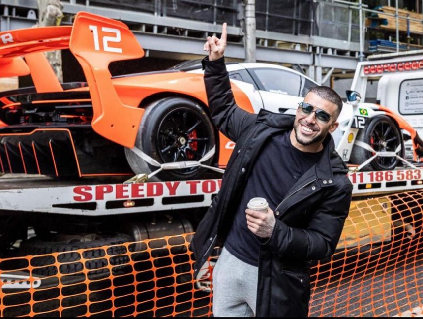 Australian millionaire causes outrage by taking a \$3M race car by crane up to his \$39M penthouse