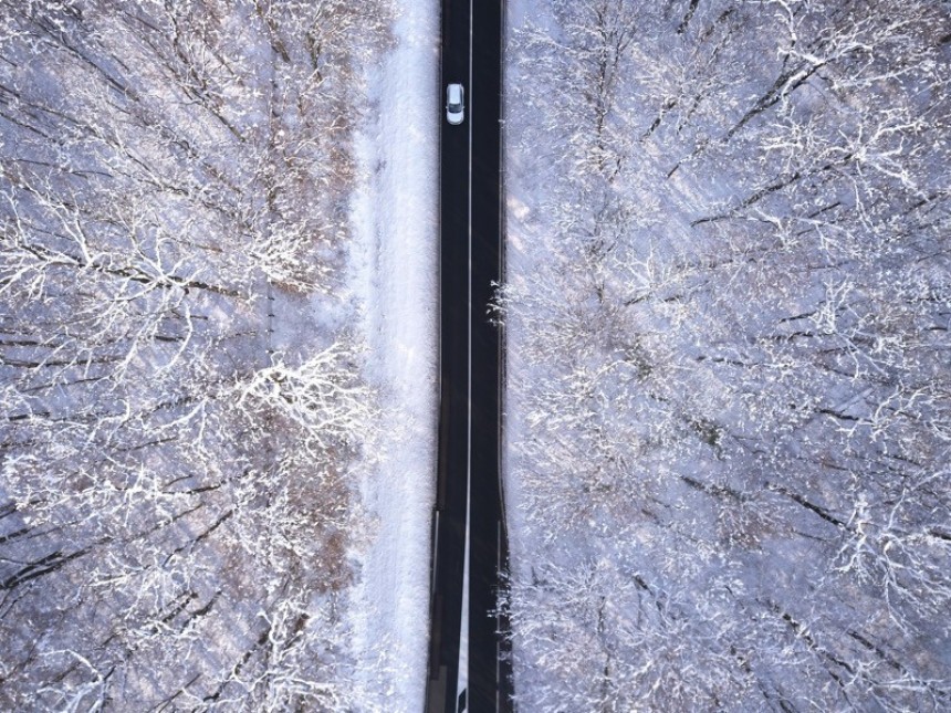 Top view photo of roadway surrounded by trees