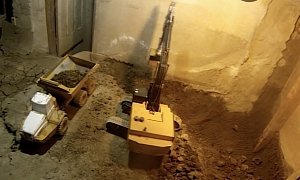 14 Years In, Man Still Digging Basement with Tiny RC Construction Machinery
