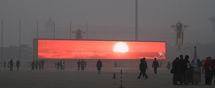 Digital commercial televisions screens playing an actual sunrise in Beijing a while ago