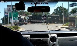 18 Wheeler Carrying Crane Gets Smashed to Pieces by Freight Train