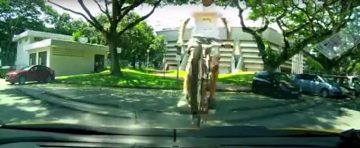 Bike rider jumping over Lambo