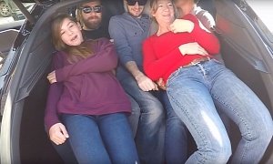 19 People Stuffed Inside a Tesla Model S Is a Cringy Record Attempt