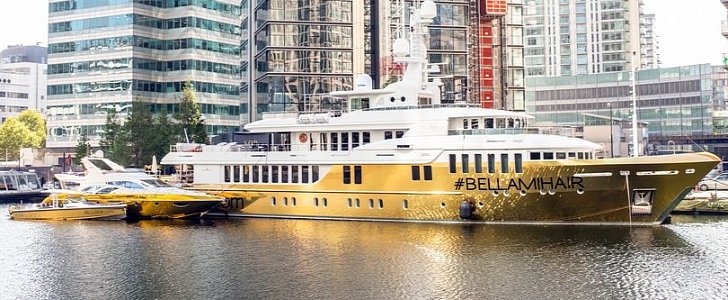$20 million superyacht wrapped in gold arrives for London Fashion Week