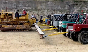20 Toyota Land Cruisers Play Tug of War with a Caterpillar D8