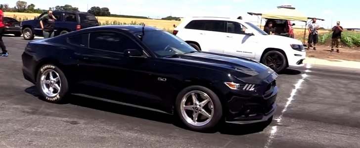 2015 Ford Mustang GT on E85 drag races supercharged Jeep Grand Cherokee SRT