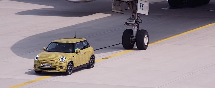 2020 MINI Cooper SE towing a Boeing 777F 