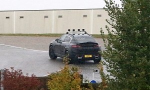 2022 Porsche Macan EV Spied Camouflaged as a Cayenne With Fake Exhaust Tips