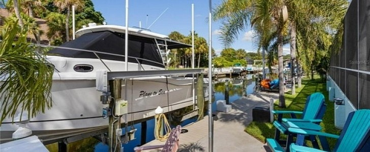 This luxury estate in Florida boasts a generous dock, perfect for the owner's boat
