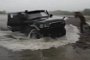 4x4 Emerges from a Lake During a Typical Russian Fishing Expedition