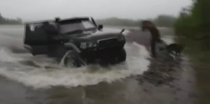 4x4 Emerges from a Laker During a Typical Russian Fishing Expedition