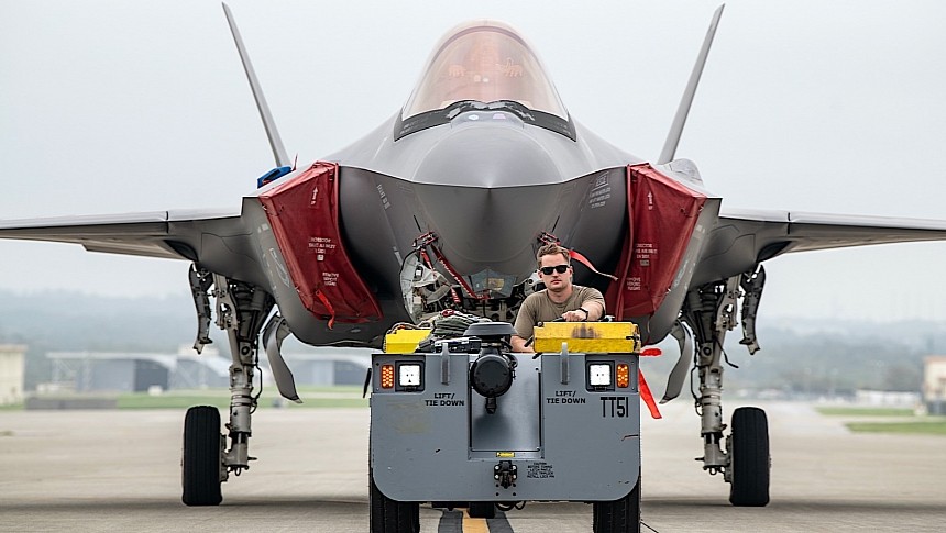Crew chief chilling while towing an F-35 Lightning