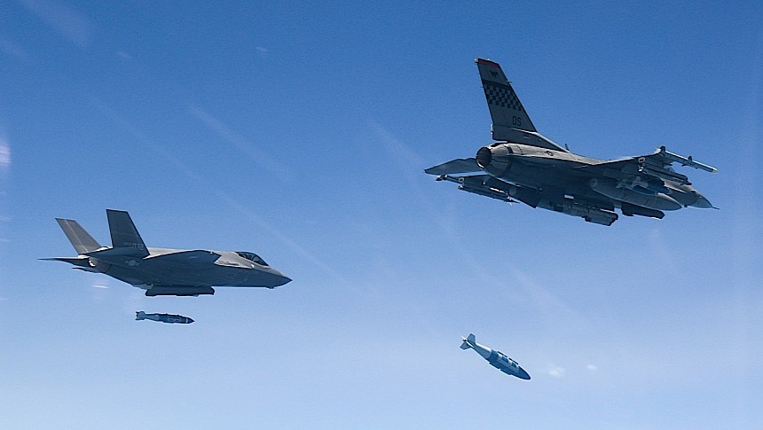F-35 Lightning and F-16 Fighting Falcon dropping bombs