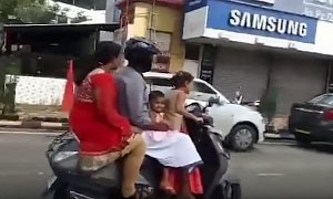 5-Year-Old Drives Scooter Like a Boss, With Mom, Dad and Sister in The Back