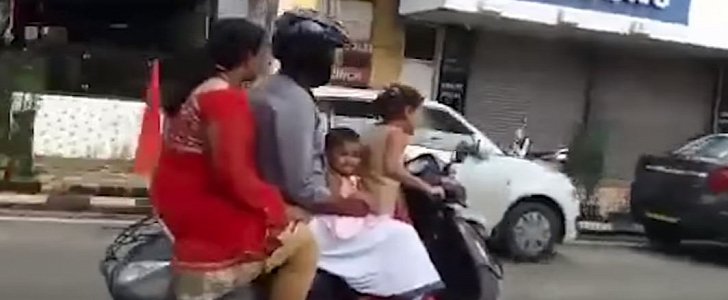 Shocking scene in India, as parents let 5-year-old drive scooter on busy road