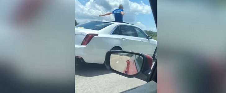 Florida driver "praises God" by standing through the moon roof of his moving Cadillac