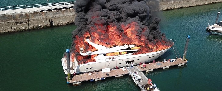 Superyacht catches fire and sinks at Torquay Harbor in England