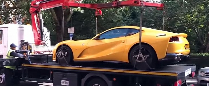 Ferrari 812 Superfast being towed away for illegal parking in London