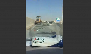 A Front Loader and a Car Perform Weird Highway Routine After Initial Crash