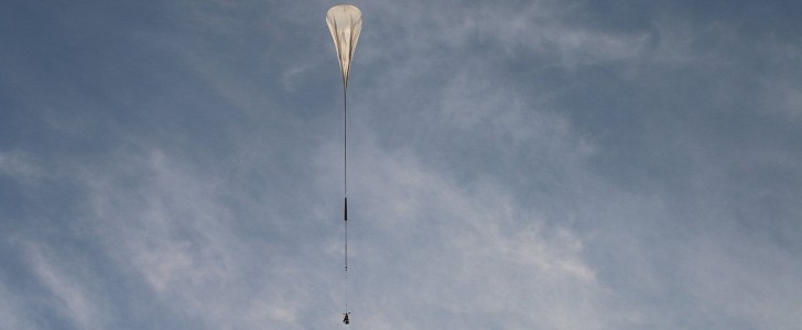 A balloon as big as a football stadium carries the SuperBIT telescope on its second flight test