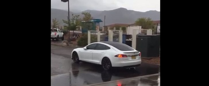 Tesla Model S and a puddle