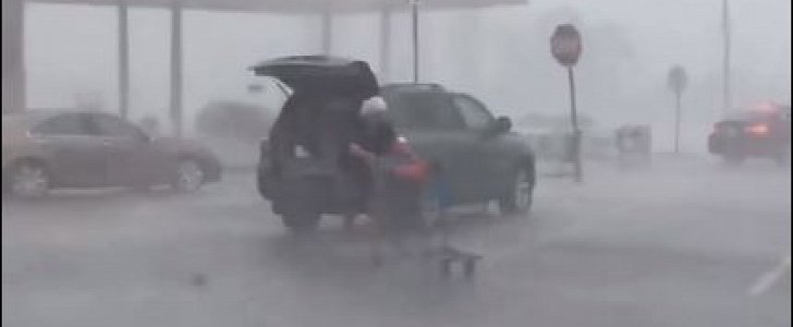 Old woman braves violent storm to return shopping cart