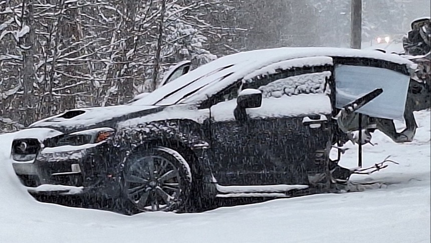 Subaru WRX slams into snowplow on a snow-packed road