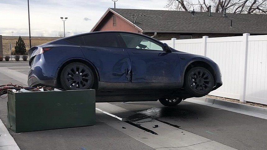 Tesla climbed on a power box at a McDonald's drive thru