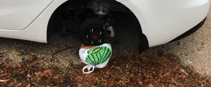 Thief takes wheel off car, leaves frozen turkey behind